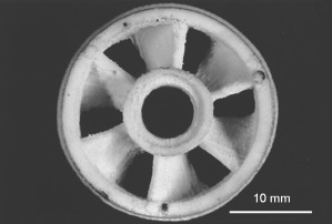 illustration of a tiny porcelain item fabricated by an inkjet publishing additive ...